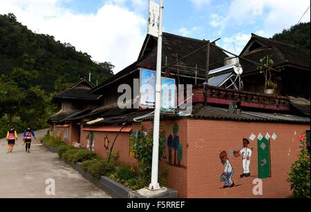 (151109) -- KUNMING, Nov. 9, 2015 (Xinhua) -- Photo taken on Nov. 5, 2015 shows a house at Bapiao Village of Jino Township in Jinghong City, Dai Autonomous Prefecture of Xishuangbanna, southwest China's Yunnan Province. Jino ethnic group is one of China's smallest nationalities with a population of over 20,000. Most of the people live in the mountainous Jino Township in southwest China's Yunnan Province. By 2014, the per capita net income of Jino people in the township has increased to 9,308 yuan (1,463 U.S. dollars), about three times more than that of a decade ago. Over 90 percent of local f Stock Photo