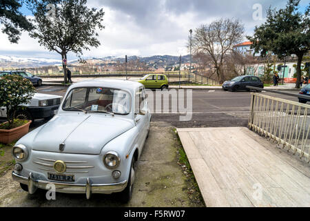 downtown street and old FIAT 600 car in Potenza, Italy. Stock Photo