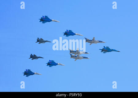 Russian Air Force fighters (Su-34, Su-24, Su-27 and MiG-29) flying in formation during the Victory Day Parade in Moscow, Russia Stock Photo