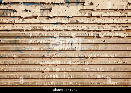 Grunge corrugated peeled metal texture, abstract industrial background. Stock Photo