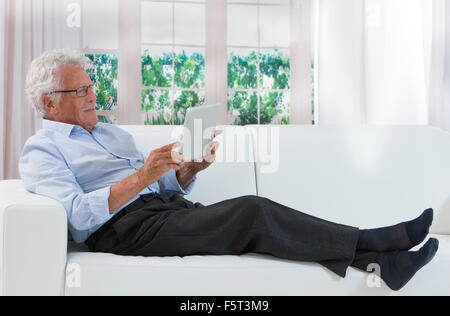 Happy senior man reading Stock Photo