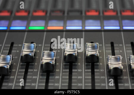 Close up view of digital mixing console. Selective focus on faders. Stock Photo