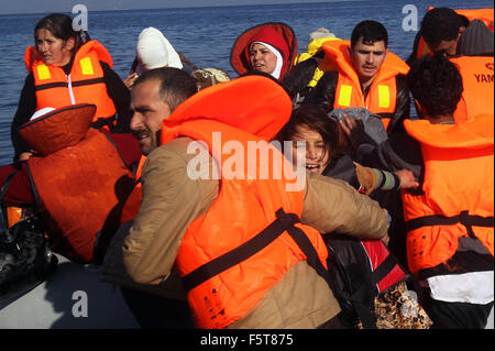 Athens, Greece. 8th Nov, 2015. Syrian and Afghan refugees land at Lesbos island, close to Eftalou, after crossing the Aegean Sea, Greece, Nov. 8, 2015. Some 20,000 refugees and migrants currently on that island and others are straining the limited reception facilities on several islands, UN spokesman Stephane Dujarric said. Credit:  Marios Lolos/Xinhua/Alamy Live News Stock Photo