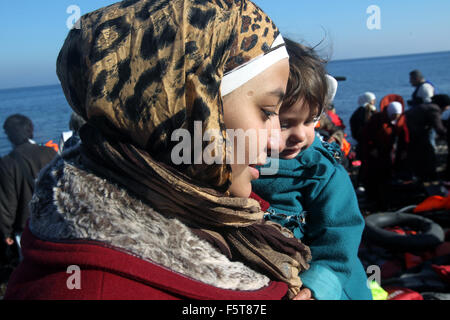 Athens, Greece. 8th Nov, 2015. Syrian and Afghan refugees land at Lesbos island, close to Eftalou, after crossing the Aegean Sea, Greece, Nov. 8, 2015. Some 20,000 refugees and migrants currently on that island and others are straining the limited reception facilities on several islands, UN spokesman Stephane Dujarric said. Credit:  Marios Lolos/Xinhua/Alamy Live News Stock Photo