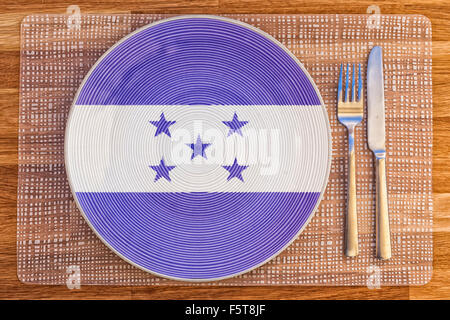 Dinner plate with the flag of Honduras on it for your international food and drink concepts. Stock Photo