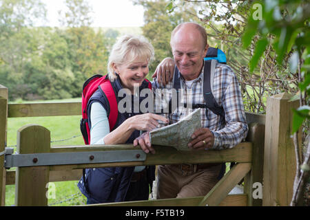 Active Senior Couple On Walk In Countryside Stock Photo