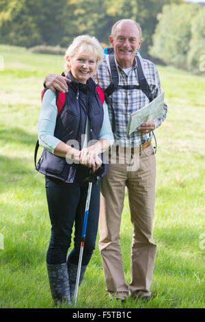 Active Senior Couple On Walk In Countryside Together Stock Photo