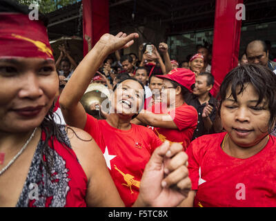 Yangon, Yangon Division, Myanmar. 9th Nov, 2015. People dance in the rain at NLD headquarters Monday afternoon. Thousands of National League for Democracy (NLD) supporters gathered at NLD headquarters on Shwegondaing Road in central Yangon to celebrate their apparent landslide victory in Myanmar's national elections that took place Sunday. The announcement of official results was delayed repeatedly Monday, but early reports are that the NLD did very well against the incumbent USDP. © Jack Kurtz/ZUMA Wire/Alamy Live News Stock Photo