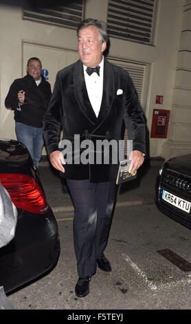 Stephen Fry and partner leaving via stage door  Featuring: Stephen Fry Where: London, United Kingdom When: 08 Sep 2015 Stock Photo