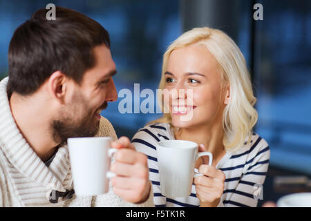 happy couple meeting and drinking tea or coffee Stock Photo