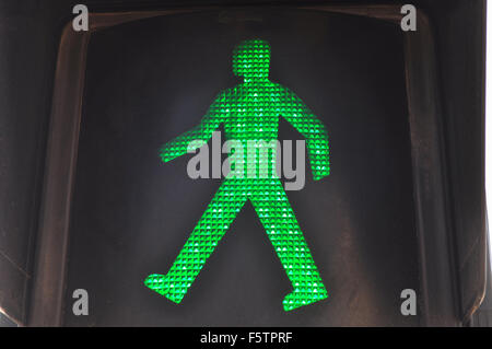 Green man in traffic light, indicating it is safe to walk and cross the road, Spain Stock Photo