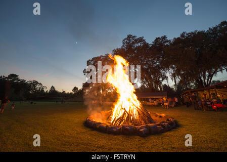Fall get together and celebration with food, music, fun and games, and of course a huge bonfire in rural North Florida. Stock Photo
