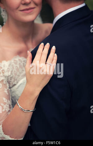 gentle embrace bride and groom Stock Photo