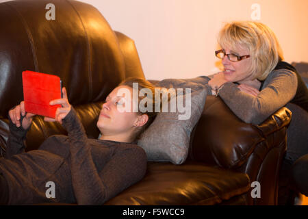 two women using digital tablet computer Stock Photo