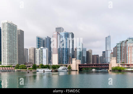 View of skyscrapers along the Chicago River where Lake Shore Drive crosses the double-deck bascule Outer Drive Bridge. Stock Photo