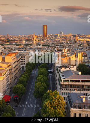 Sunset light on Montparnasse Tower and Avenue Marceau rooftops in the 16th arrondissement, Paris, France Stock Photo