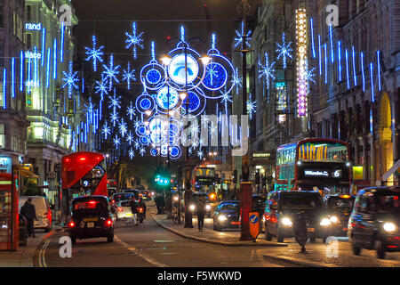 London, UK. 9th November 2015. The first ever Christmas lights on the Northbank in The Strand in London are switched on. 137 years ago the Strand was the first street in London to get electric lighting, but it is one of the last to get its own Christmas lights and decorations. Credit:  Paul Brown/Alamy Live News Stock Photo