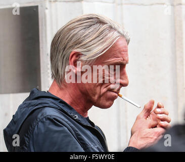 Paul Weller smoking a cigarette outside the BBC Radio 6 studios  Featuring: Paul Weller Where: London, United Kingdom When: 15 Sep 2015 Stock Photo