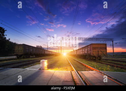 Cargo train platform at night. Railroad in Ukraine. Railway station. Stock Photo