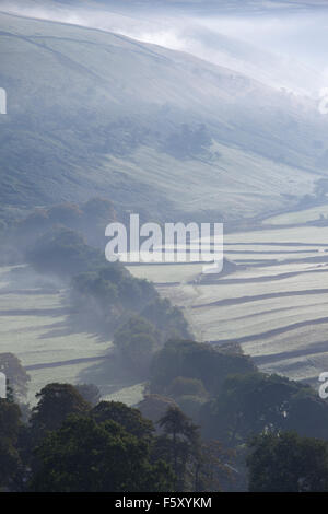 View down the side-lit valley of Littondale from near Halton Gill village, Littondale, Yorkshire Dales, North Yorkshire, UK Stock Photo