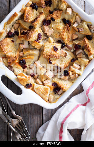Bread pudding breakfast casserole with pear and dried cranberry Stock Photo