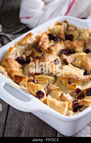 Bread pudding breakfast casserole with pear and dried cranberry Stock Photo