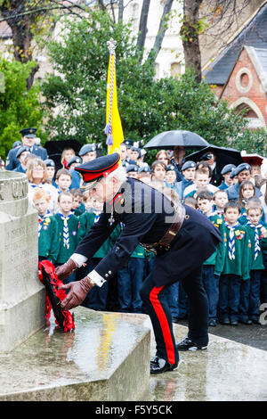 England, Ramsgate. Remembrance Day. Senior military officer laying wreath at war memorial during ceremony in the rain. Stock Photo