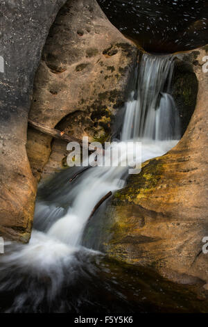 Exotic, silky cascade of a waterfall at Kent Falls State Park in Connecticut, with foam that looks like stars. Stock Photo