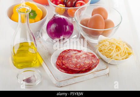 ingredients for baked eggs with vegetables and chorizo. Spanish breakfast Stock Photo