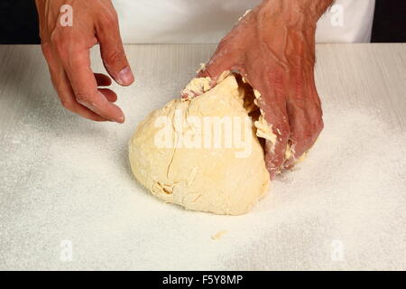 Preparing Dough, kneading. Making Yeast Sweet Roll Bun Stock Photo