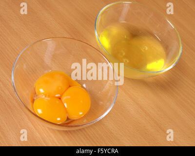 Separated egg yolk and white. Making Chocolate Layer Cake with Cream Cheese Filling and Chocolate Topping. Series. Stock Photo