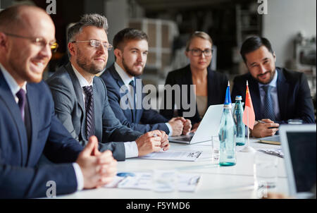 Business group of people attending and listening at conference Stock Photo