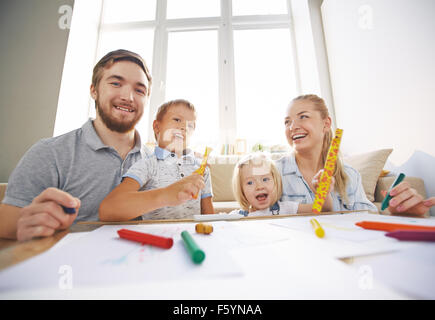 Young couple spending weekend with their little son and daughter Stock Photo