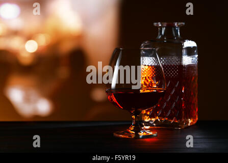 Snifter with brandy on black table in bar Stock Photo