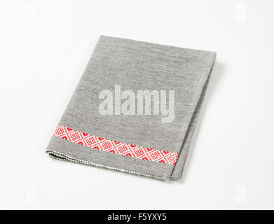 gray place mat with red stripe on white background Stock Photo