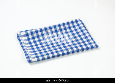 blue and white checkered tablecloth on white background Stock Photo