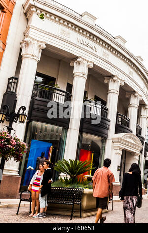 Tourists taking photos on Via Rodeo off Rodeo Drive in Beverly Hills California Stock Photo