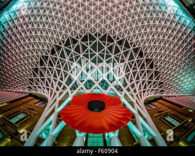 London, UK. 9th November, 2015.  Large Poppy at Kings Cross Station for Remembrance Day.  Bailey-Cooper Photography/Alamy Live News Stock Photo