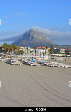 Early morning on Arenal beach, Javea, Costa Blanca, with deck chairs in the foreground and Montgo Mountain in the background. Stock Photo