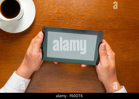 man holding in his hands tablet computer Stock Photo