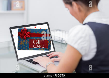Composite image of gift card with festive bow Stock Photo