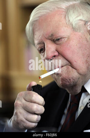 FILE - A file picture dated 29 September 2010 shows former German Chancellor Helmut Schmidt lighting a cigarette during a luncheon at the Axel Springer publishing house in Berlin, September 29, 2010. The former head of state took part in the unveiling of a bronze statue of former US President George Bush to stand along side statues of former Soviet President Michail Gorbachev and Chancellor Helmut Kohl at the Springer's Berloin headquarters, some days ahead of the 20th anniversary of Germany's reunification on October 3. PHOTO: ODD ANDERSEN Stock Photo