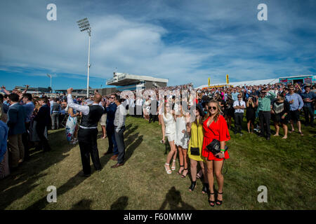 Christchurch, New Zealand. 10th Nov, 2015. Christchurch, New Zealand - November 10, 2015 - Racegoers enjoy the atmosphere during the New Zealand Trotting Cup Day at Addington Raceway on November 10, 2015 in Christchurch, New Zealand. Credit:  dpa/Alamy Live News Stock Photo