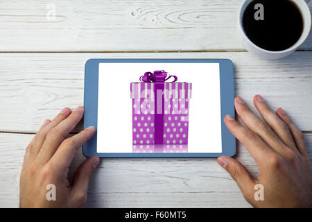 Composite image of purple and silver gift box Stock Photo