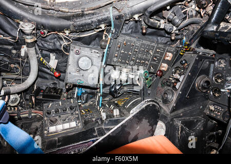 Interior of RAF Canberra bomber showing pilot's seat with front and side control panels. Stock Photo