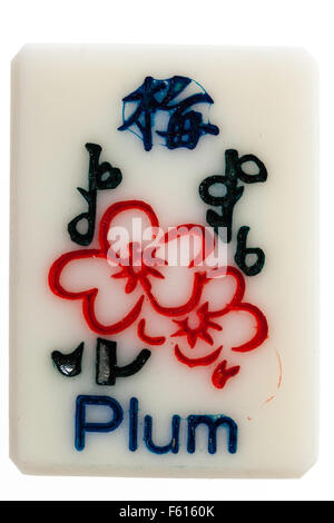 MahJong ivory tile from the Chinese gambling game, part of the four flower bonus set, the plum tile. Stock Photo