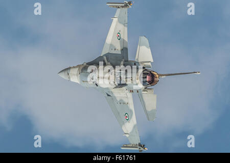 Gray jet fighter General Dynamics F-16 Fighting Falcon during demo flight at Dubai AirShow. Stock Photo