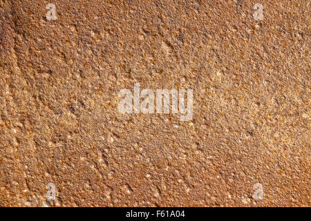 Brown plastered concrete wall background texture detail Stock Photo