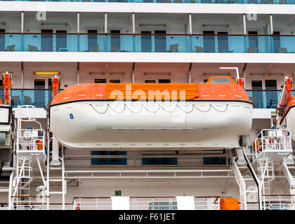 orange life boat on a cruise ship Stock Photo