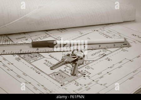 architect drawn plans with keys to property Stock Photo